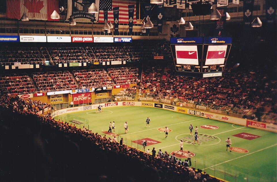 A packed arena watching an NLL box lacrosse game in progress