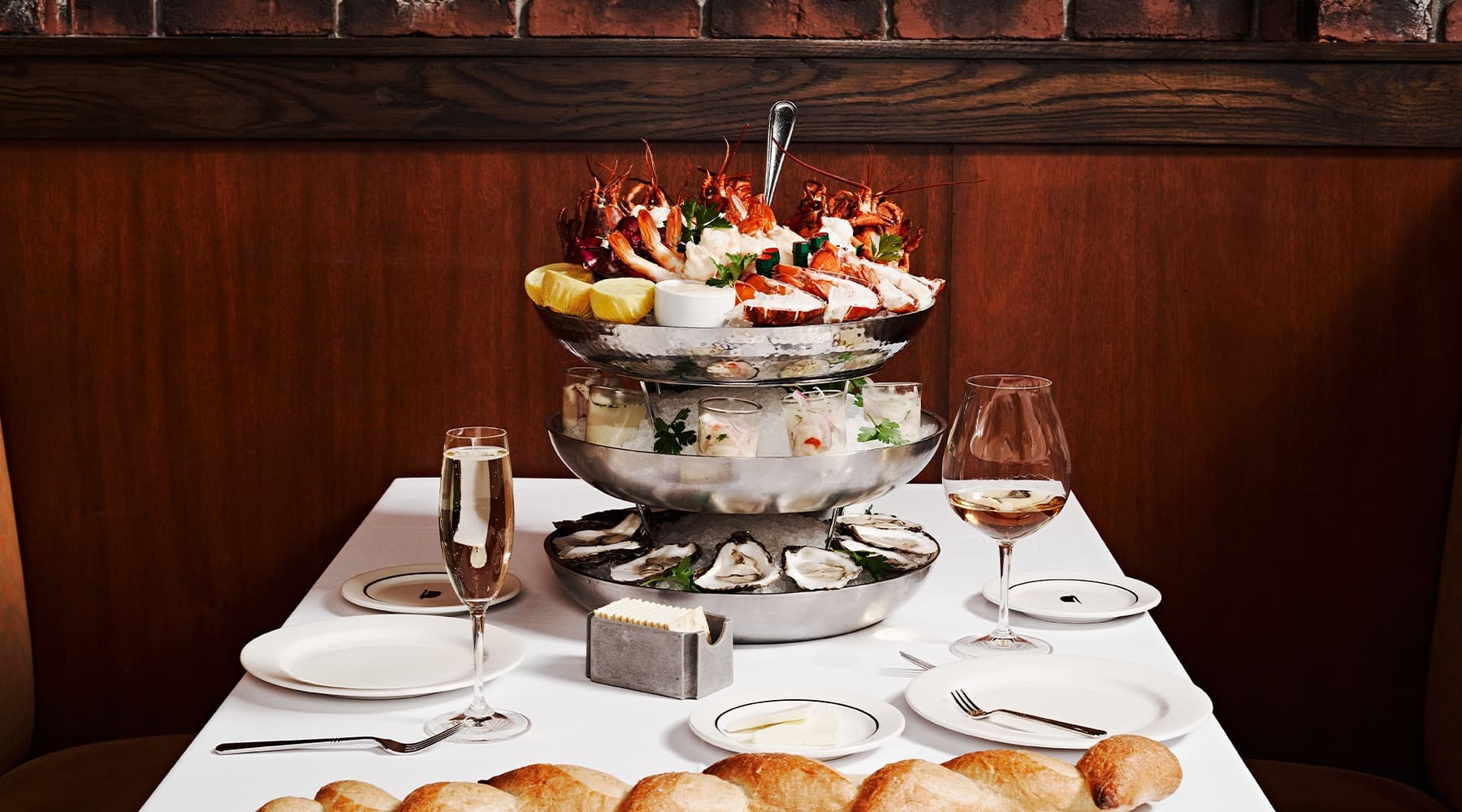 The seafood tower — lobster, oysters, and ceviche